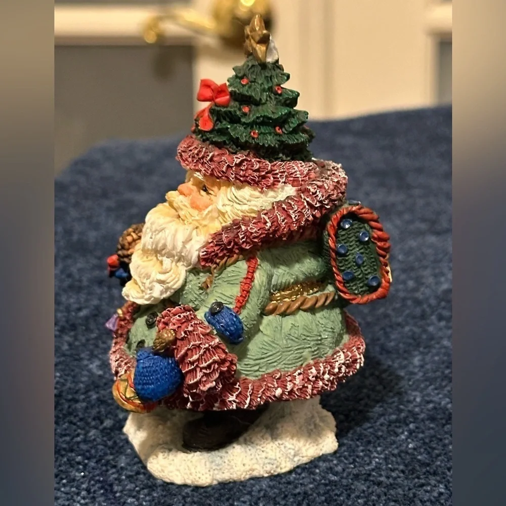 Mini Santa dressed for traveling! Wears a Christmas tree hat!